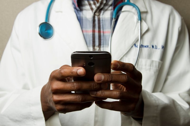 Patient smiling during a telehealth video consultation at home